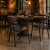 ZEN - krzesło czarne sztaplowane z podłokietnikami aranżacja w restauracji loft