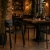 ZEN - krzesło czarne sztaplowane z podłokietnikami aranżacja w restauracji loft